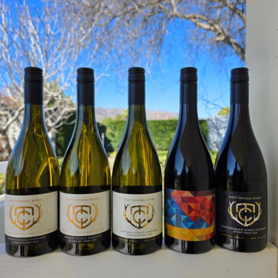 5 bottles of Matt Connell wines from central otago with spring day in background